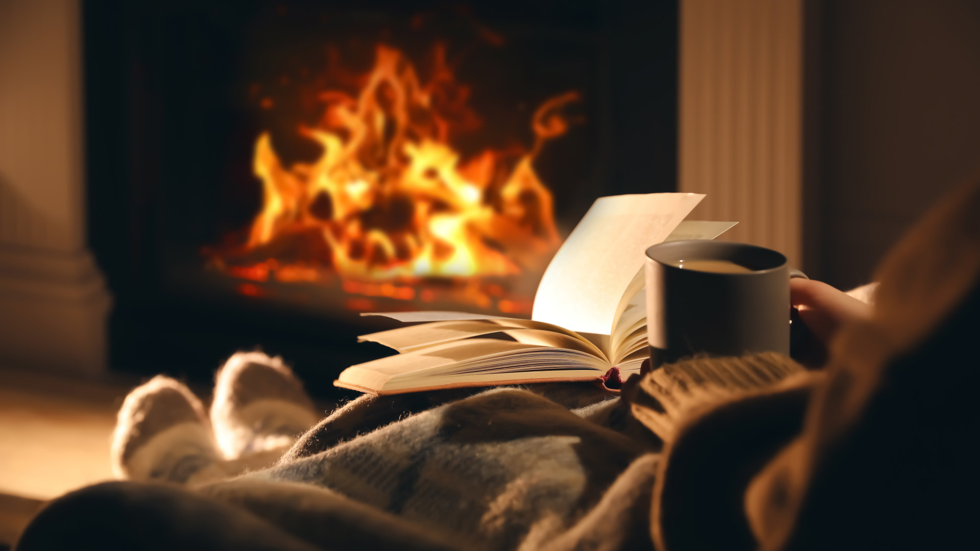 Closeup photo of family feet in woolen socks lying next to fireplace